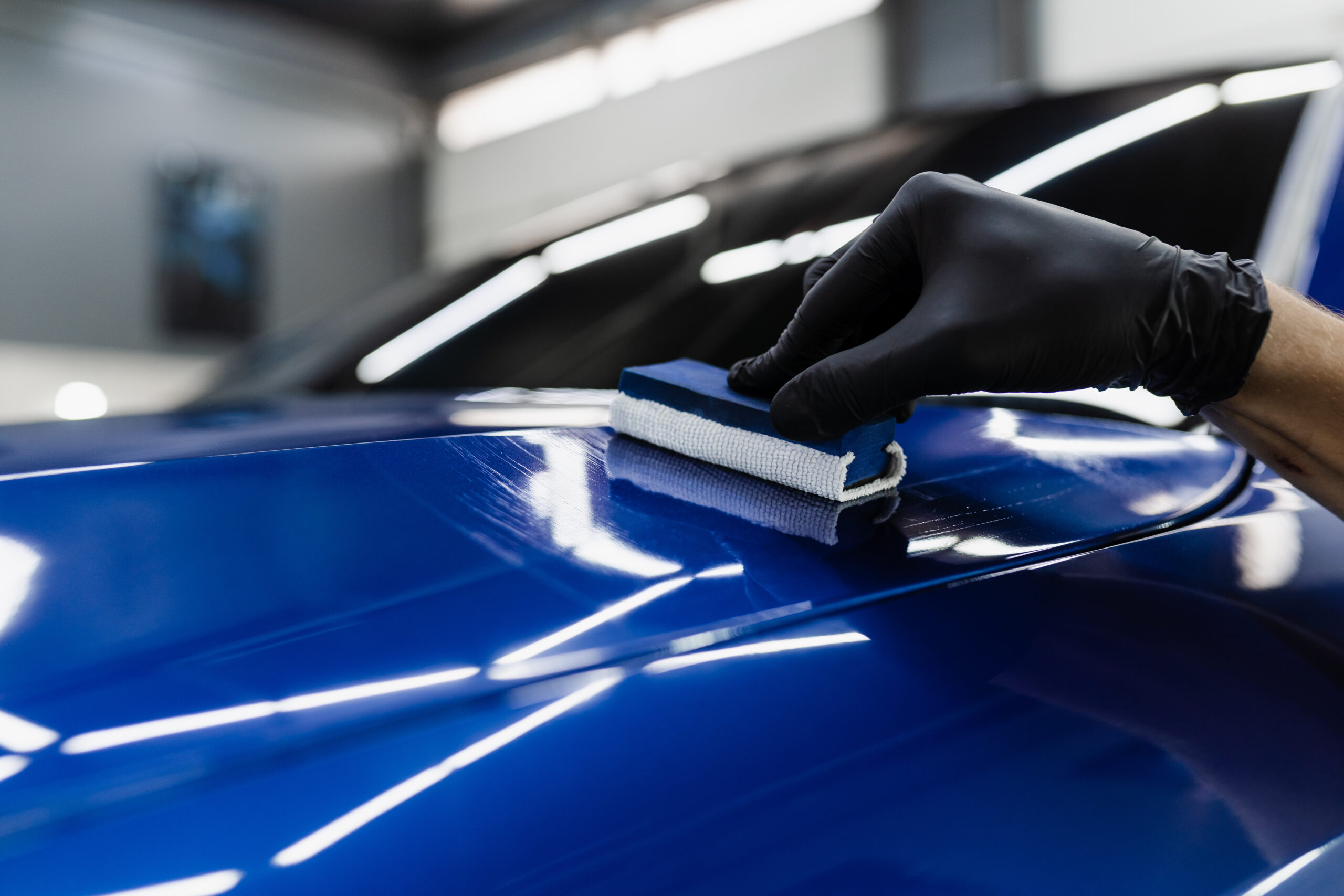 process-applying-ceramic-protective-coat-body-car-detailing-auto-service-car-service-worker-apply-ceramic-coating-protect-car-body-from-scratches-scaled.jpg