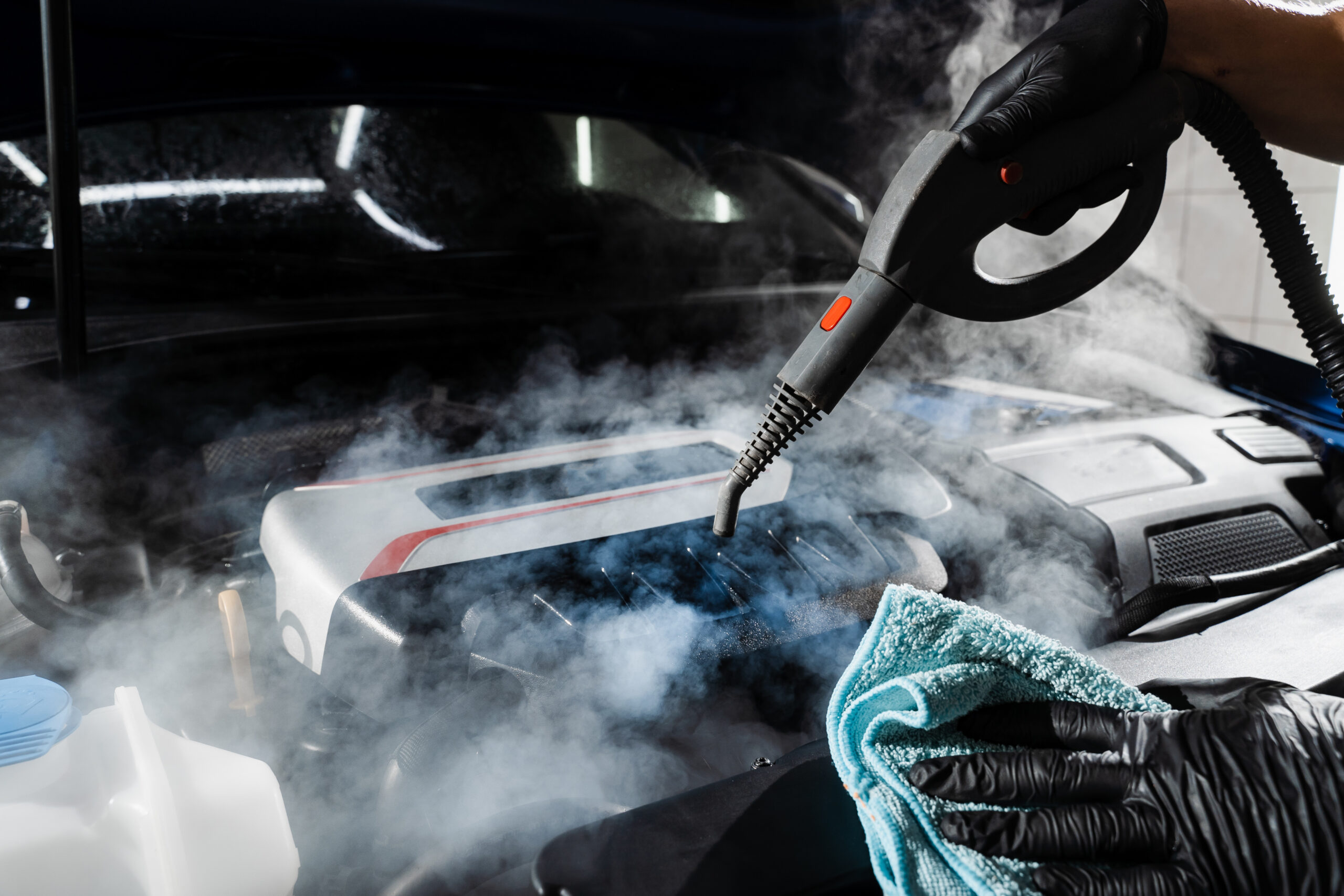 process-steam-cleaning-car-engine-from-dust-dirt-steaming-washing-motor-auto-detailing-auto-service-scaled-1.jpg